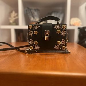 Black aldo purse with faux gold flowers